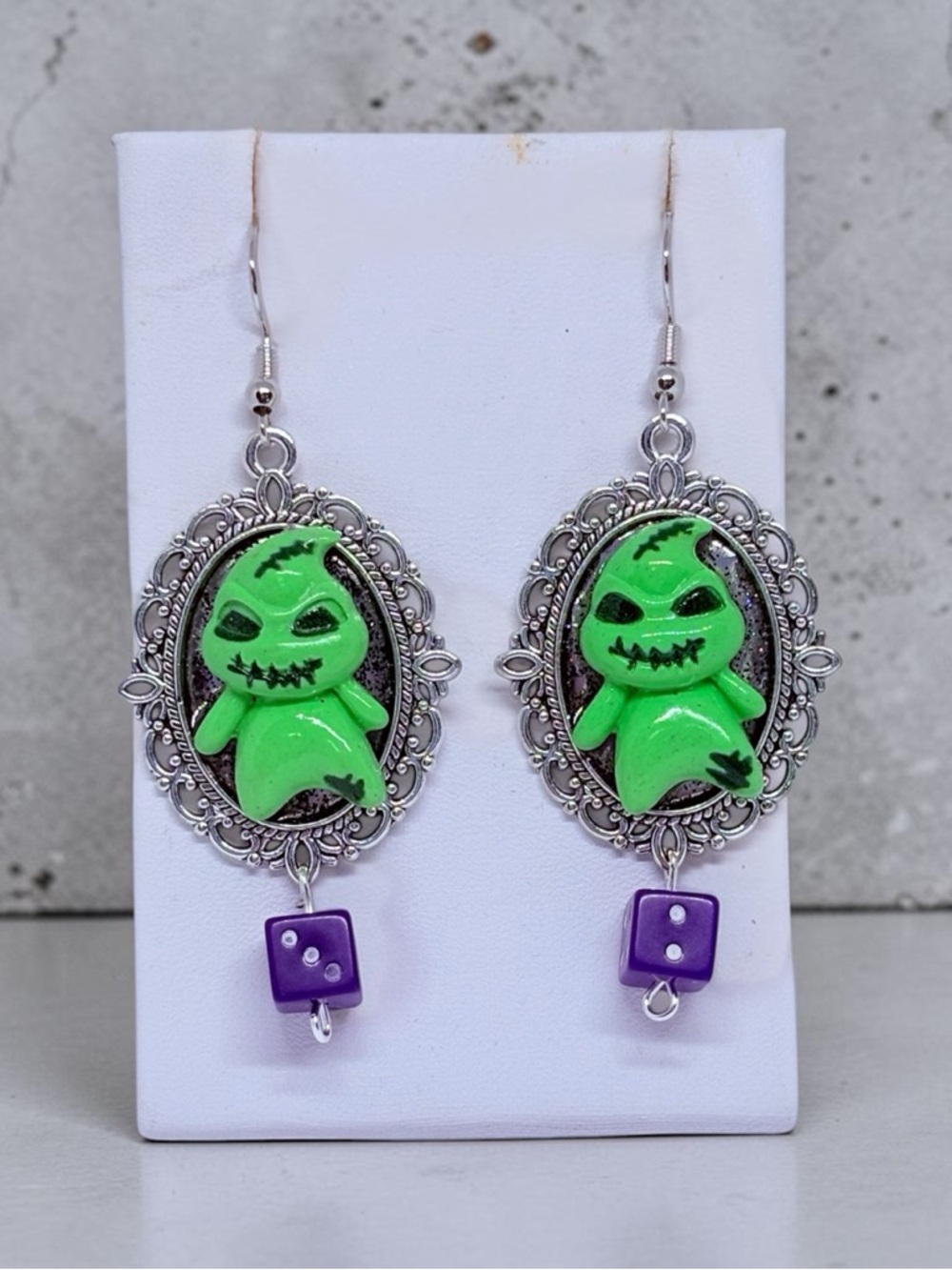Green Ghost Cameo Earrings with Purple Dice Accents